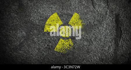 Yellow radioactive sign on dark stone background, banner design. Radiological pollution Stock Photo