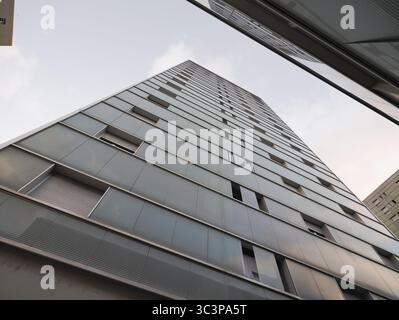 residential facade of urban area with modern style. Building color in blue tones with the sky in the background Stock Photo