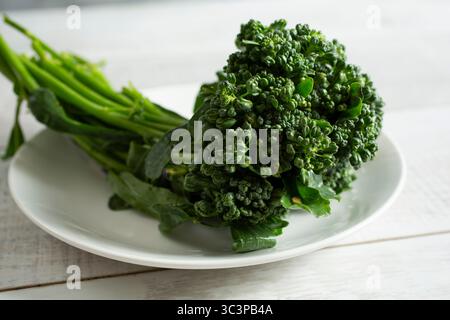 A view of a portion of broccolini on a plate. Stock Photo