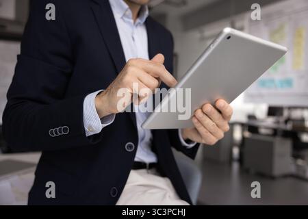 Business man using tablet in modern office Stock Photo