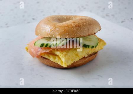 A view of an egg and smoked salmon bagel. Stock Photo