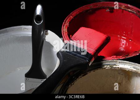 EMBARGOED TO 0001 MONDAY JULY 28 File photo dated 08/02/13 of a general view of paint brushes resting on tins of paint. The typical cost of some popular home renovations has fallen in recent months, analysis of job inquiries indicates. Issue date: Monday July 28, 2025. Stock Photo