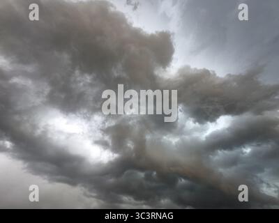 Dark discoloured storm clouds Cloud roll above grey clouds Rain clouds herald thunderstorms, Germany Stock Photo