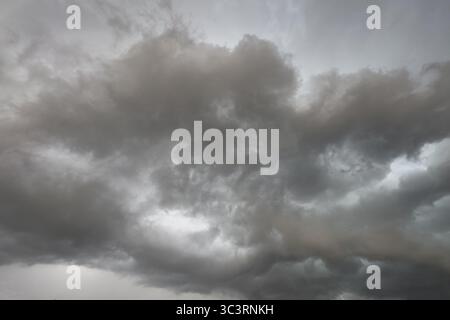 Dark discoloured storm clouds Cloud roll above grey clouds Rain clouds herald thunderstorms, Germany Stock Photo
