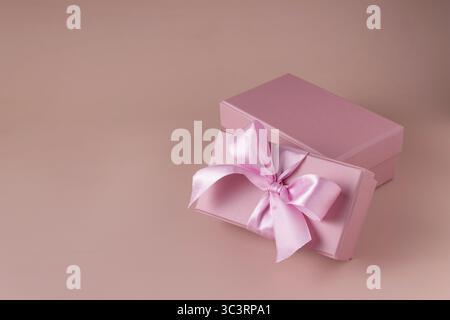 Pink gift boxes on beige background Stock Photo