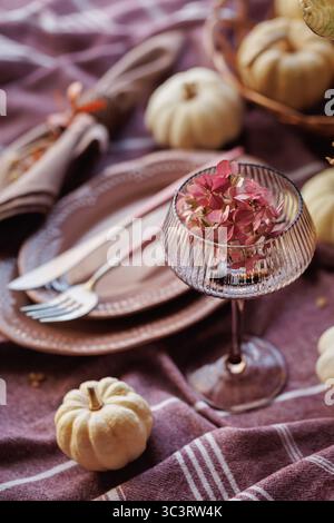 Elegant fall tablescape with pumpkins and seasonal decor Stock Photo