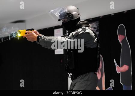 EMBARGOED TO 0001 MONDAY JULY 28 A taser demonstration during the launch of a taser trial in the adult male prison estate at the Operational Response & Resilience Unit (ORRU) training site in Kidlington, Oxfordshire. Picture date: Thursday July 24, 2025. Stock Photo