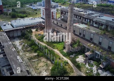 The chimney of the old city heating boiler house. Stock Photo