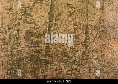 Heavily distressed and deeply scratched brown wood surface. Stock Photo