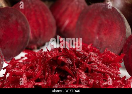 Fresh raw red beetroot grated, beet recipes. Stock Photo
