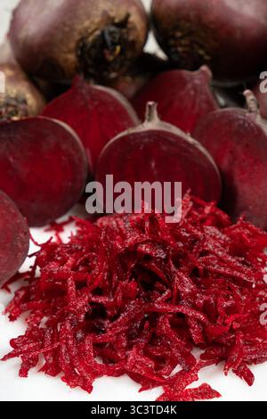 Fresh raw red beetroot grated, beet recipes. Stock Photo