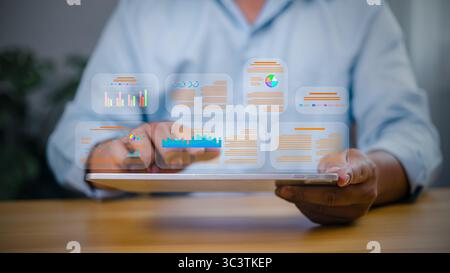 Data analytics concept with businessman using tablet to analyze digital report and charts. Business intelligence and technology dashboard. Stock Photo