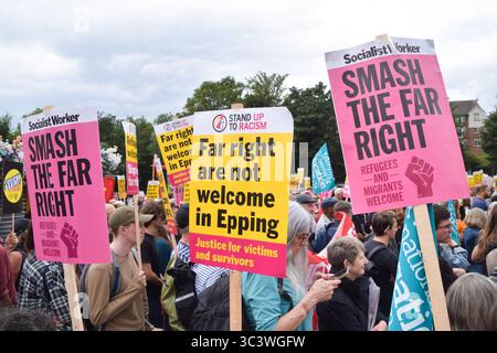 Epping, UK. 27th July 2025. Protesters gather outside Epping Station ahead of the march in support of migrants. Several anti-migrant protests targeting the Bell Hotel, where migrants are housed, have taken place after an asylum seeker was charged with allegedly trying to kiss a 14-year-old girl. Credit: Vuk Valcic/Alamy Live News Stock Photo