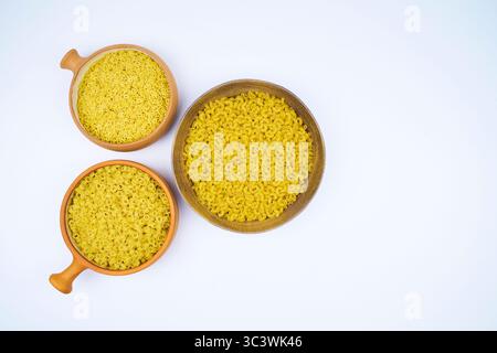 Various types of raw pasta in different containers in an isolated shot, with copy space on a white background Stock Photo
