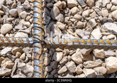Rebar tied together, over stone base prior to concrete being installed. Stock Photo