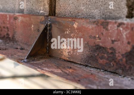 Close up of an existing structural steel lintel being reinforced, repaired prior to bricks being reinstalled. Stock Photo
