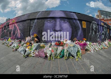 Ozzy Osbourne - Black Sabbath Mural - Navigation Street, Birmingham, with flowers and other gifts of respect following the death of Ozzy. Stock Photo