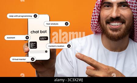 Man showcasing chatbot features on smartphone against bright orange background in a modern setting Stock Photo