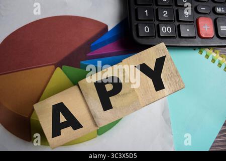 The word APY on stacked wooden cubes on the table. Business and finance concept Stock Photo