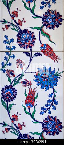Ornate blue and red handmade Turkish Iznik mosaic tiles with floral Islamic patterns in a traditional Ottoman style in Istanbul, Turkey Stock Photo