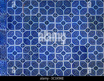 Ornate blue and red handmade Turkish Iznik mosaic tiles with floral Islamic patterns in a traditional Ottoman style in Istanbul, Turkey Stock Photo