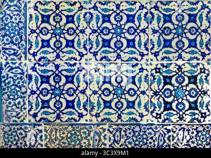 Ornate blue and red handmade Turkish Iznik mosaic tiles with floral Islamic patterns in a traditional Ottoman style in Istanbul, Turkey Stock Photo
