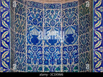 Ornate blue and red handmade Turkish Iznik mosaic tiles with floral Islamic patterns in a traditional Ottoman style in Istanbul, Turkey Stock Photo