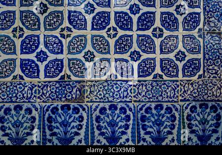 Ornate blue and red handmade Turkish Iznik mosaic tiles with floral Islamic patterns in a traditional Ottoman style in Istanbul, Turkey Stock Photo