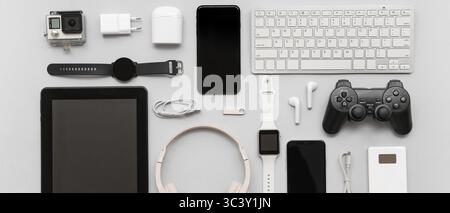 Many different modern gadgets on grey background Stock Photo