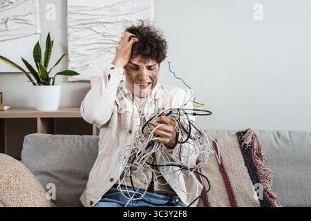 Electrocuted young man with burn face and wires at home Stock Photo - Alamy