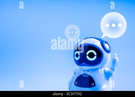 White smart cute 3d robot raising hand with speech bubbles isolated on blue background with copyspace. AI smart bot, chatbot customer service, artific Stock Photo