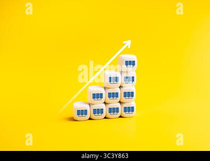 Arrow rising on white cube blocks as growth graph steps with data center icons. Data center growth, increased demand for digital infrastructure, high- Stock Photo