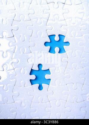 Business solutions, solving problems, missing and incomplete concept. Two blue empty space from missing piece, gap surrounded on white blank jigsaw pu Stock Photo