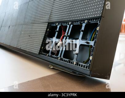 LED perimeter cabinet of a sports field with two broken LED modules. Stock Photo