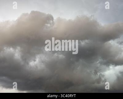 Dark discoloured storm clouds Cloud roll above grey clouds Rain clouds herald thunderstorms, Germany Stock Photo