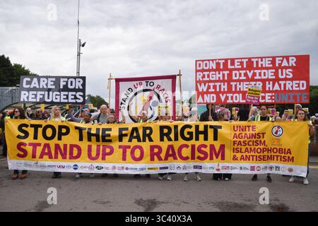 Epping, England, UK. 27th July, 2025. Protesters march in support of migrants in Epping. Several anti-migrant protests targeting the Bell Hotel, where migrants are housed, have taken place after an asylum seeker was charged with allegedly trying to kiss a 14-year-old girl. (Credit Image: © Vuk Valcic/ZUMA Press Wire) EDITORIAL USAGE ONLY! Not for Commercial USAGE! Stock Photo