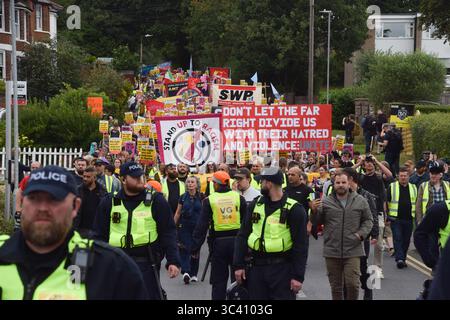 Epping, England, UK. 27th July, 2025. Protesters march in support of migrants in Epping. Several anti-migrant protests targeting the Bell Hotel, where migrants are housed, have taken place after an asylum seeker was charged with allegedly trying to kiss a 14-year-old girl. (Credit Image: © Vuk Valcic/ZUMA Press Wire) EDITORIAL USAGE ONLY! Not for Commercial USAGE! Stock Photo