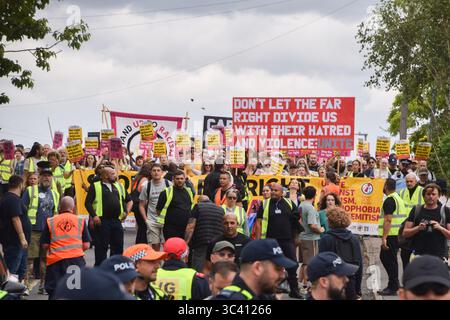 Epping, England, UK. 27th July, 2025. Protesters march in support of migrants in Epping. Several anti-migrant protests targeting the Bell Hotel, where migrants are housed, have taken place after an asylum seeker was charged with allegedly trying to kiss a 14-year-old girl. (Credit Image: © Vuk Valcic/ZUMA Press Wire) EDITORIAL USAGE ONLY! Not for Commercial USAGE! Stock Photo