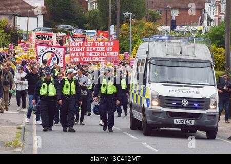 Epping, England, UK. 27th July, 2025. Protesters march in support of migrants in Epping. Several anti-migrant protests targeting the Bell Hotel, where migrants are housed, have taken place after an asylum seeker was charged with allegedly trying to kiss a 14-year-old girl. (Credit Image: © Vuk Valcic/ZUMA Press Wire) EDITORIAL USAGE ONLY! Not for Commercial USAGE! Stock Photo