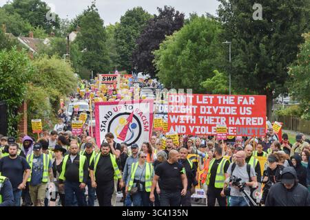 Epping, England, UK. 27th July, 2025. Protesters march in support of migrants in Epping. Several anti-migrant protests targeting the Bell Hotel, where migrants are housed, have taken place after an asylum seeker was charged with allegedly trying to kiss a 14-year-old girl. (Credit Image: © Vuk Valcic/ZUMA Press Wire) EDITORIAL USAGE ONLY! Not for Commercial USAGE! Stock Photo