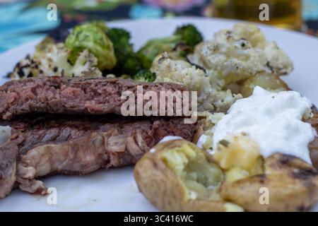 Grilled cauliflower and steak on a summer dinner plate Stock Photo
