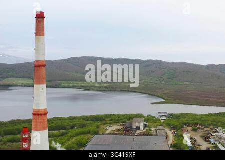 The chimney of old city heating boiler house. Stock Photo