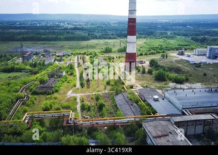 The chimney of old city heating boiler house. Stock Photo