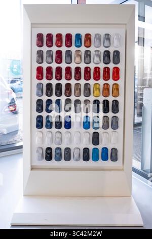 Car paint color samples with matte and glossy textures for multiple models, showroom palette, glossy finishes, premium interior display, Mini car mode Stock Photo