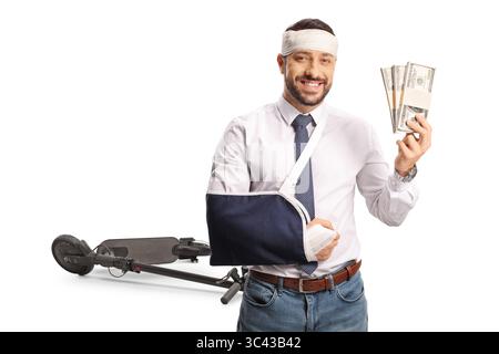 Man injured in an accident with electric scooter holding stacks of money isolated on white background Stock Photo