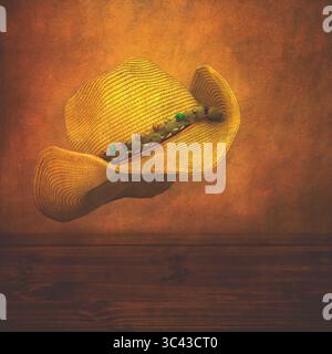 New ladies straw cowboy hat floating above a wooden table with a textured distressed background. UK, 2025 Stock Photo