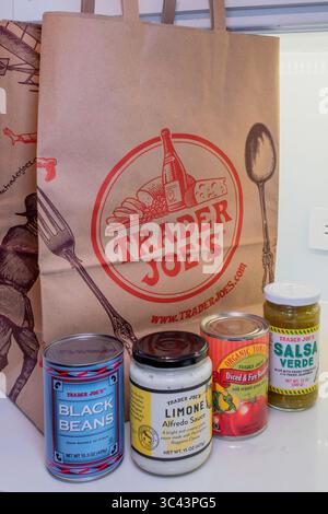 Kitchen counter with store brand products and Trader Joe's shopping bag,  USA  2025 Stock Photo