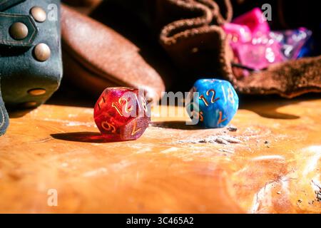 Red And Blue D12 Dice On Wooden Tabletop Stock Photo