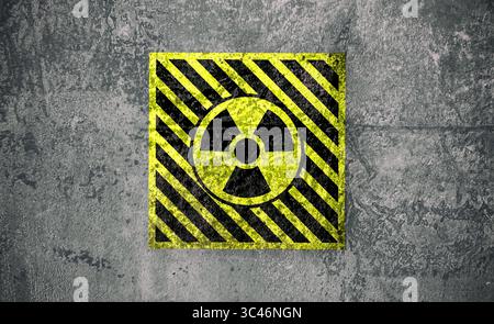 Radioactive sign on grey textured surface. Radiological pollution Stock Photo