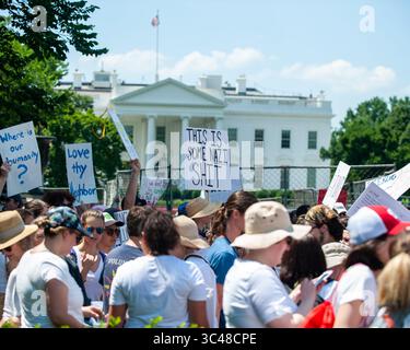 June 30, 2018 - Washington, District of Columbia, U.S. - Protesters walk past the White House durning the "Families Belong Together Rally in Washington, D.C. (Credit Image: © Michael A. McCoy via ZUMA Wire) Stock Photo